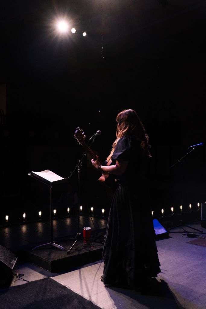 Amanda Grace on stage, wide shot with stage lights